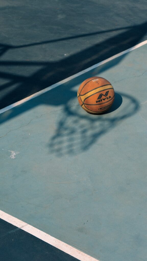 a basketball sitting on top of a basketball court
